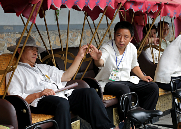 Beijing - Rickshaw drivers awaiting a fare