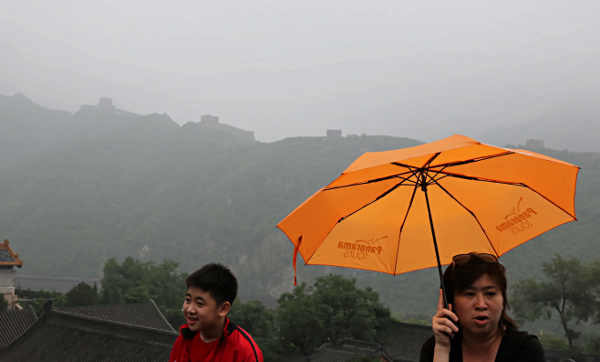 My first visit to the Great Wall of China - Orange umbrella in a very light drizzle