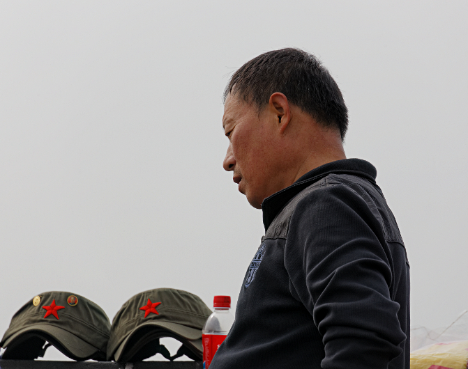 Great Wall of China at Mutianyu
 - Mao hat salesman