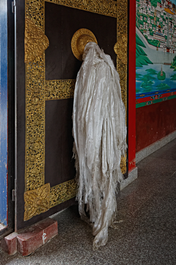 Shangri-la City - Monastery Door with Traditional Tibetan Shawls