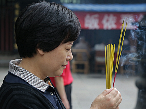 Szechuan Province, China
 - Woman Meditating in the Smoke at a Buddist Temple in Changdu