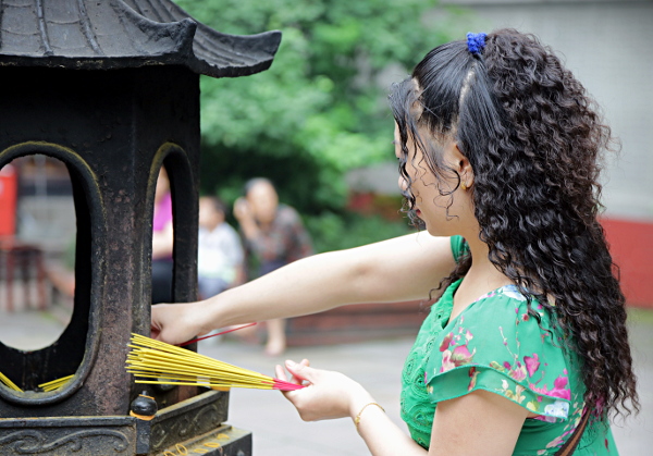 Szechuan Province, China
 - Lighting Incense