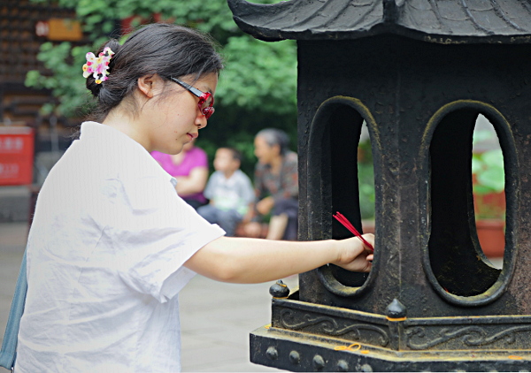 Szechuan Province, China
 - Lighting Incense