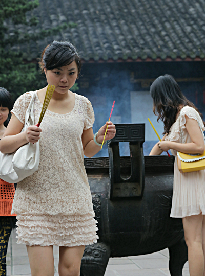 Szechuan Province, China
 - Lighting Incense