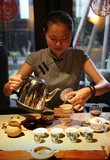 Szechuan Province, China
 - Serving Tea at a Tea House