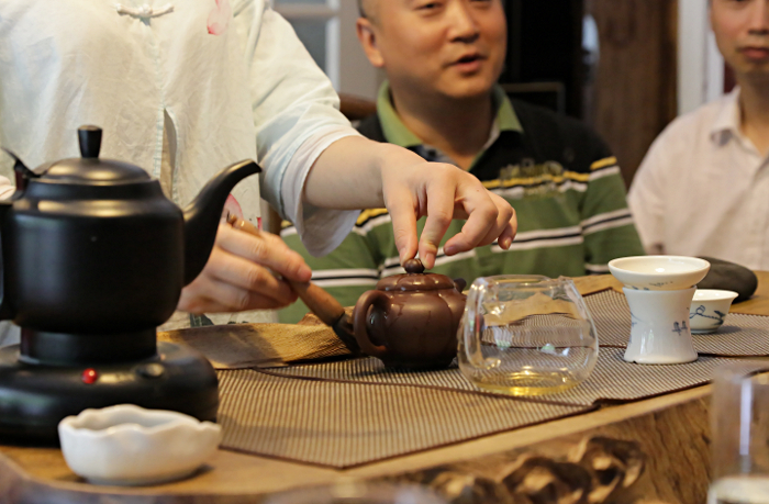 Szechuan Province, China
 - Brushing the Teapot with Old Tea