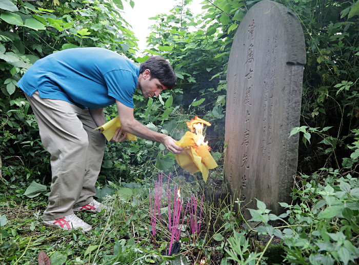 Szechuan Province, China
 - Burning Paper at the Grave. - Usually money is sent to the next world to help the deceased. When a person has reached the enlightment, he has no need for money. Hence plain paper is burnt at his grave.