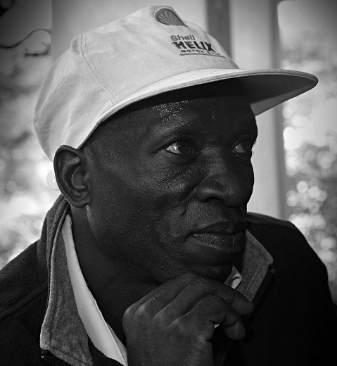 Africans in Black & White - Local Man Listening to Rabbi Riskin in Nairobi, Kenya