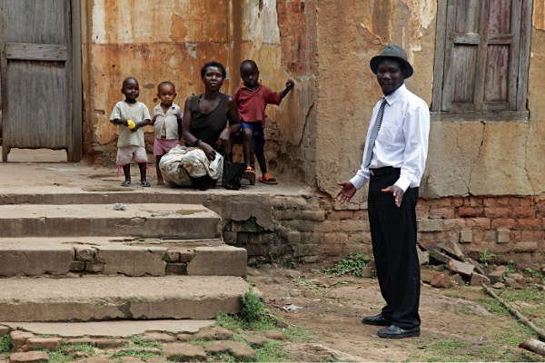 Visit to Kakungulu's House, Gangama, at the Foot of Mount Elgon, Uganda - Enosh Introducing the Caretaker's Wife
