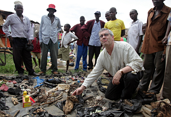 Market Day, Uganda - Burn This Dead and Dried Eagle Chick and Cure Madness