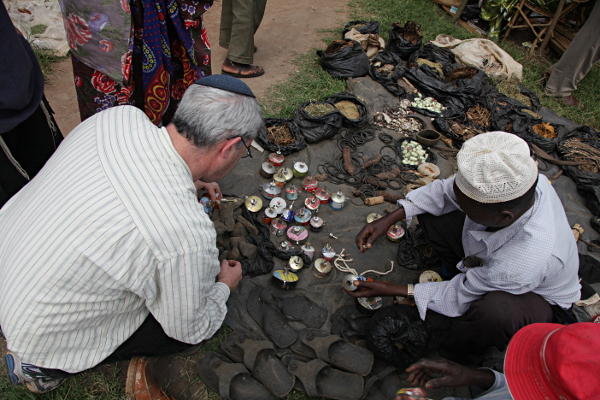 Market Day, Uganda - Buying Kerosene Lamps