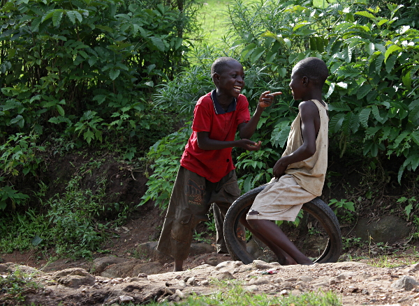 Visiting the Abayudaya in Nabugoye, Uganda - Two Happy Boys Playing With a Tyre