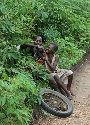 Visiting the Abayudaya in Nabugoye, Uganda - Two Happy Boys With a Goat