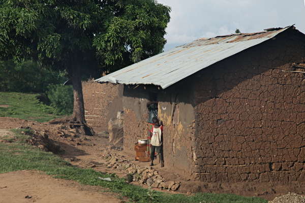 Visiting the Abayudaya in Nabugoye, Uganda - Boy and Girl Outside Their Wattle and Daub Home