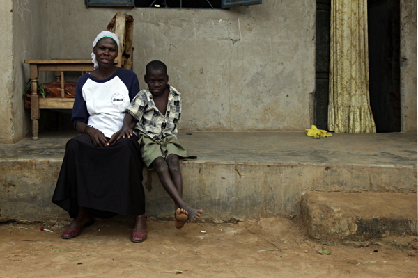 Visiting the Abayudaya Tribe in Putti, Uganda - Mother and Son Outside House