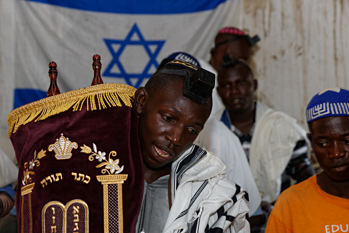 Putti Synagogue, Uganda
 - Moshe Carrying the Torah to the Bima