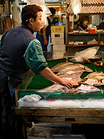 The largest Fish Market in the world - Pen ready on his ear to take an order