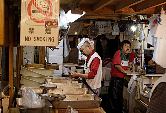 The largest Fish Market in the world - What's so strange . . . he's just cutting up some fish, like he does every other day