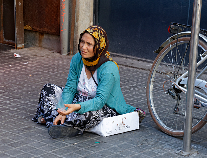 A day in Barcelona - Street beggar near market. - [Nearly] all the beggars are women and girls. 