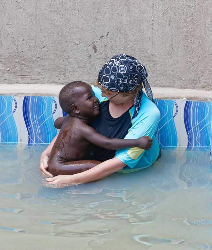 A Spiritual Experience in Africa - Jill emersing Yoav Yonatan Keki for his orthodox conversion in the Putti . He wasn't as happy once he emerged from the water.