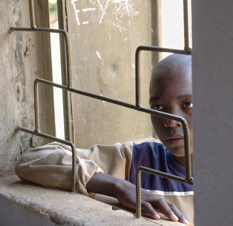 A Spiritual Experience in Africa - The synagogue is packed -- no room for the entire community. Many of the children resorted to looking in and listening to the proceddings via one of the sysnagogue's paneless windows.