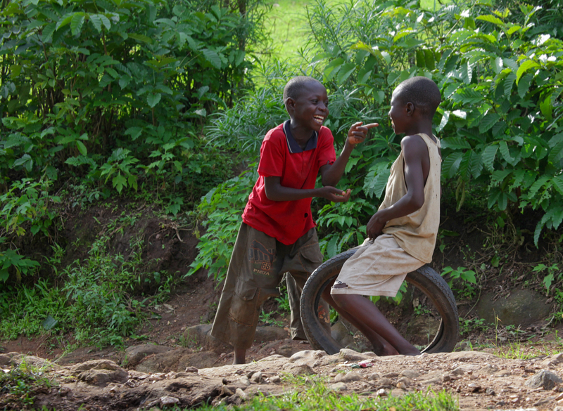 A Spiritual Experience in Africa - Games I have seen in many third world countries. Here two boys playing with an old bicycle tyre in Nabagoye, Uganda.